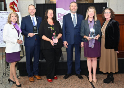 Bridget Mahoney (ODVN Former Board Chair), Senator Nathan Manning, Annette Chambers-Smith (Director of the Ohio Department of Rehabilitation and Correction), Attorney General Dave Yost, House Minority Leader Allison Russo, and Mary O'Doherty (ODVN Executive Director)